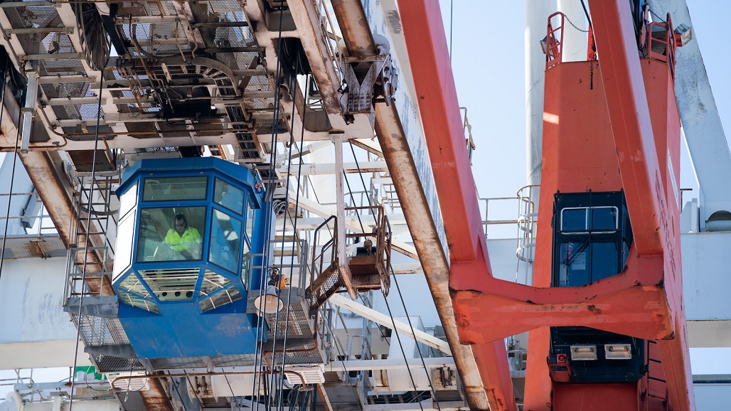 GARDEN CITY, GA - NOVEMBER 12: A crane operator works at the Garden City Port Terminal on November 12, 2021 in Garden City, Georgia. The terminal recently completed construction of the Mason Mega Rail Station, doubling the Port of Savannah’s rail lift capacity to one million containers per year. (Photo by Sean Rayford/Getty Images)